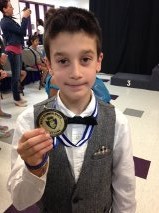 Jacob holding his Gold Medal!
